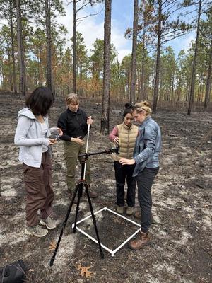 Kira, Ivy, Jordan, and Hanshi setting up NatureSpec for grass spectra measurement